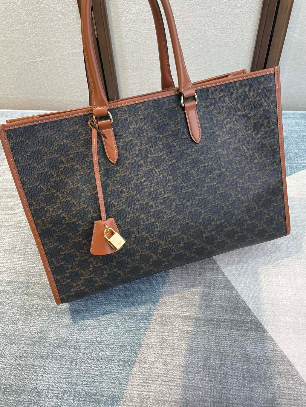 CELINE 25S HORIZONTAL CABAS 43MM IN BLACK TRIOMPHE CANVAS AND TAN BROWN CALFSKIN