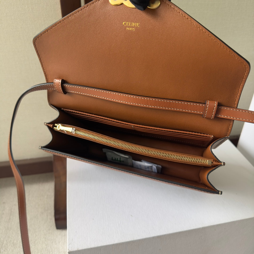 CELINE 25S WALLET MARGO 22MM IN BLACK TRIOMPHE CANVAS AND BROWN CALFSKIN