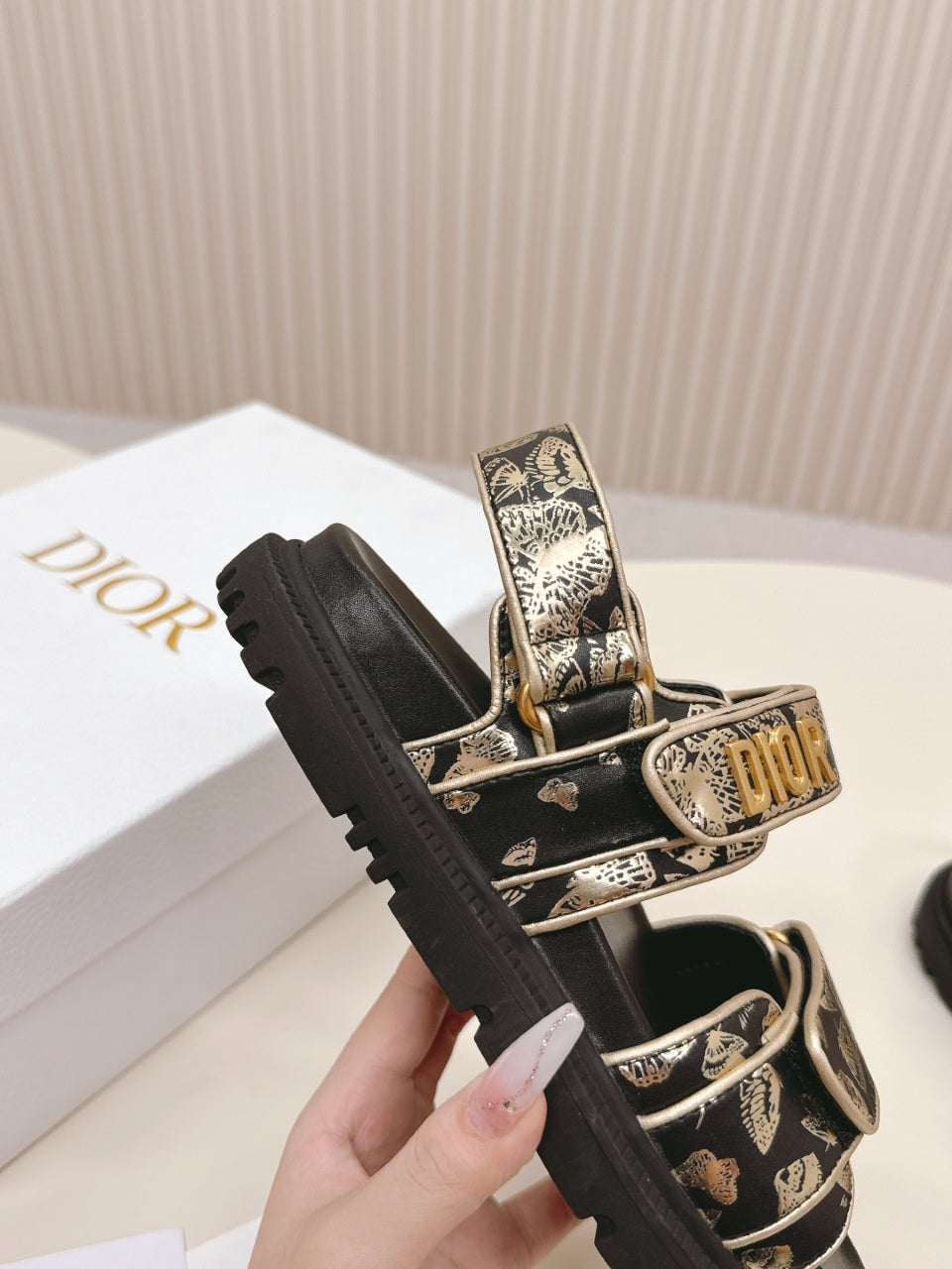 DIOR BACK-STRAP SANDALS 25S IN BLACK AND GOLD CALFSKIN WITH BUTTERFLY MOTIF